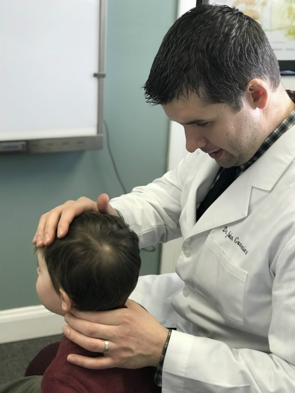 Dr. John Guarnieri adjusting a young patient at Wyoming Valley Chiropractic Center